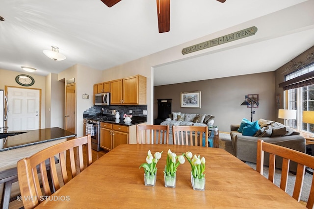 dining space with a ceiling fan