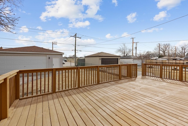 deck featuring an outbuilding and a detached garage