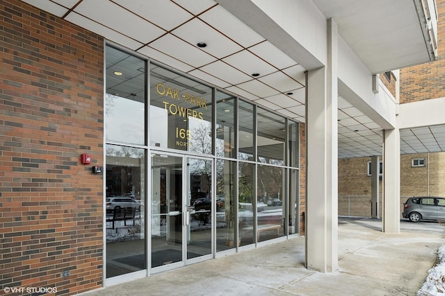 entrance to property with brick siding