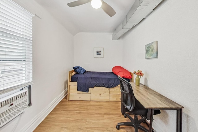 bedroom with ceiling fan, light wood-type flooring, lofted ceiling, and baseboards