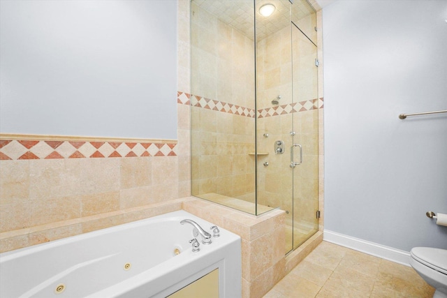 bathroom with tile patterned floors, toilet, a shower stall, baseboards, and a tub with jets