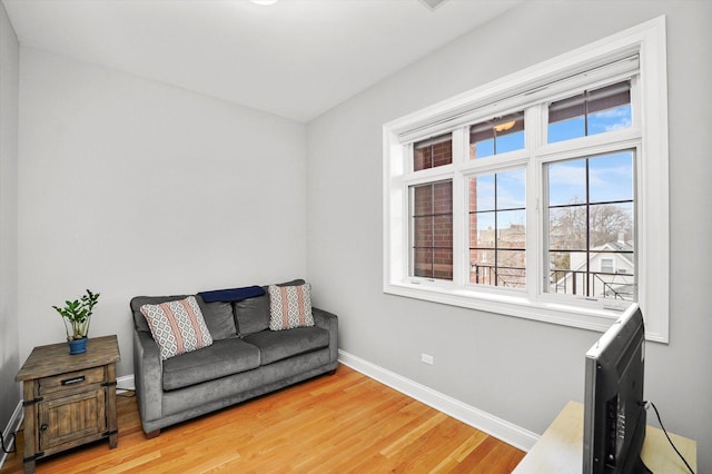 sitting room featuring light wood-style floors and baseboards