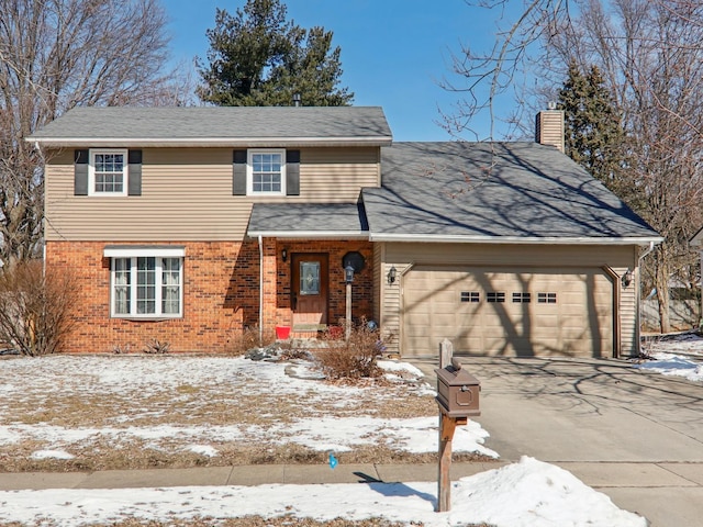 traditional home featuring a garage, driveway, brick siding, and a chimney