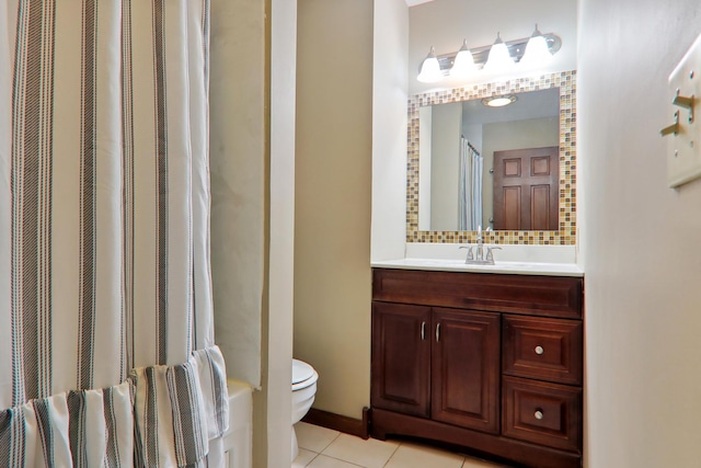 bathroom featuring vanity, curtained shower, tile patterned floors, toilet, and tasteful backsplash