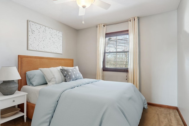 bedroom featuring a ceiling fan, carpet, and baseboards