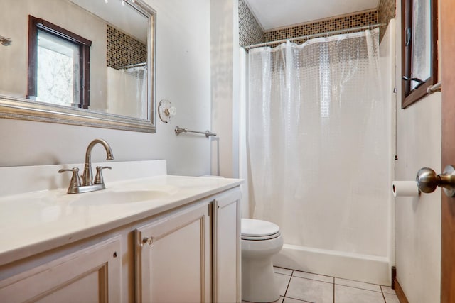 full bathroom with tile patterned floors, a shower with shower curtain, toilet, and vanity