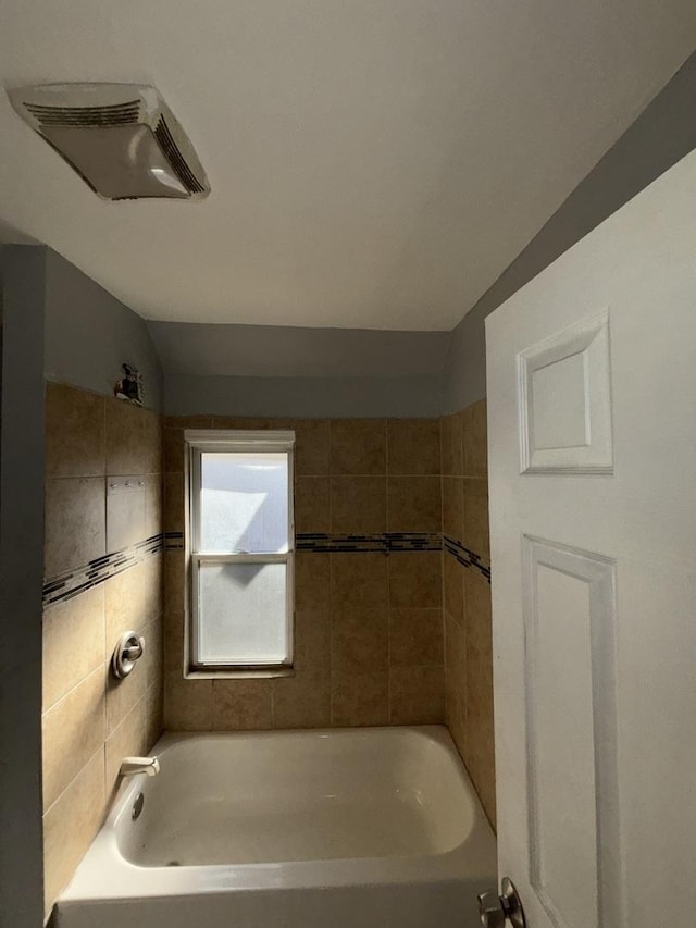 full bath with vaulted ceiling, shower / bath combination, and visible vents