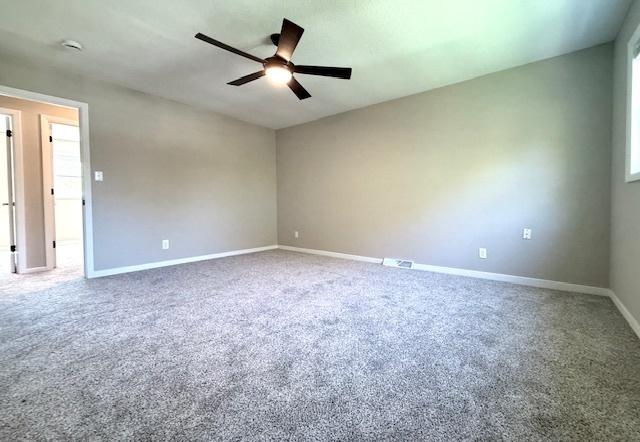 1816 Sadler Dr, Champaign, IL 61821 - carpeted spare room with ceiling fan and baseboards