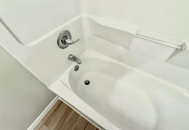 1816 Sadler Dr, Champaign, IL 61821 - bathroom view of wood finished floors and bathtub / shower combination