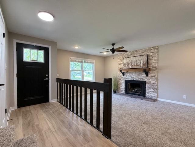 1816 Sadler Dr, Champaign, IL 61821 - entrance foyer featuring baseboards, ceiling fan, and a stone fireplace