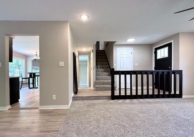 1816 Sadler Dr, Champaign, IL 61821 - stairway with baseboards, wood finished floors, and recessed lighting