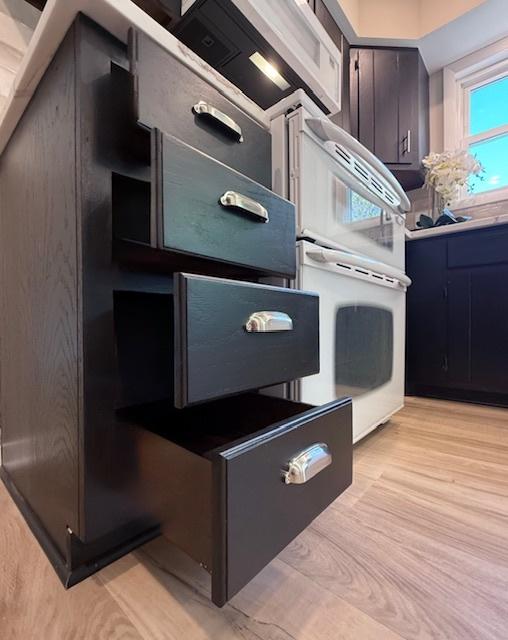 1816 Sadler Dr, Champaign, IL 61821 - kitchen with oven and light wood-style flooring