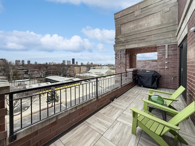 balcony with a view of city and area for grilling