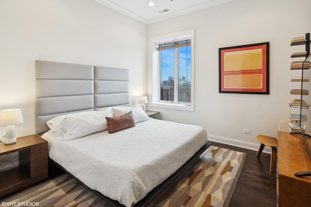 bedroom featuring recessed lighting, baseboards, crown molding, and wood finished floors