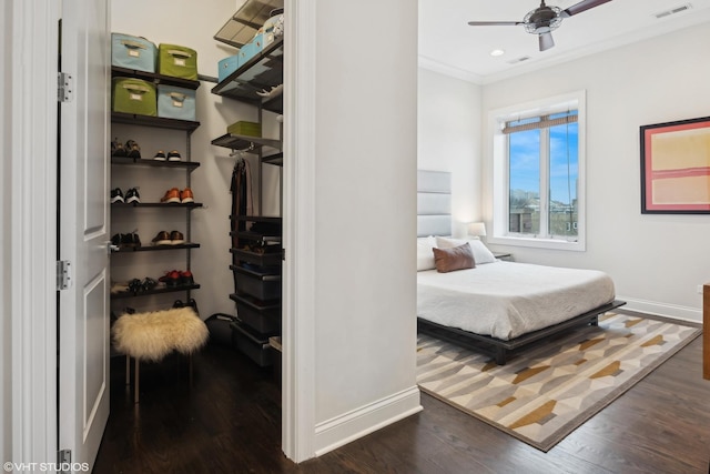 bedroom with visible vents, baseboards, dark wood finished floors, and recessed lighting