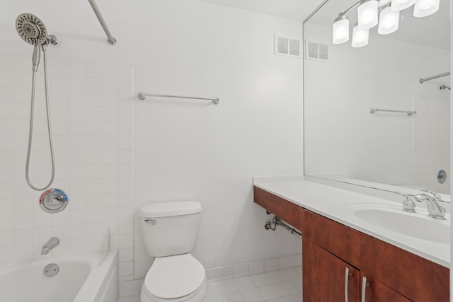 bathroom with visible vents, vanity, bathtub / shower combination, and toilet