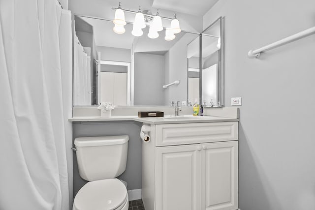 bathroom with toilet and vanity