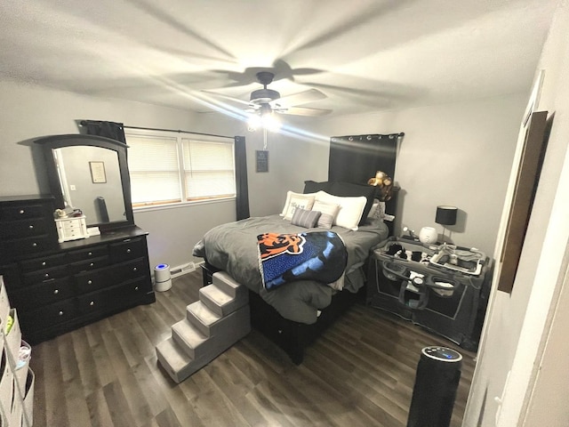 bedroom featuring dark wood-style floors and ceiling fan