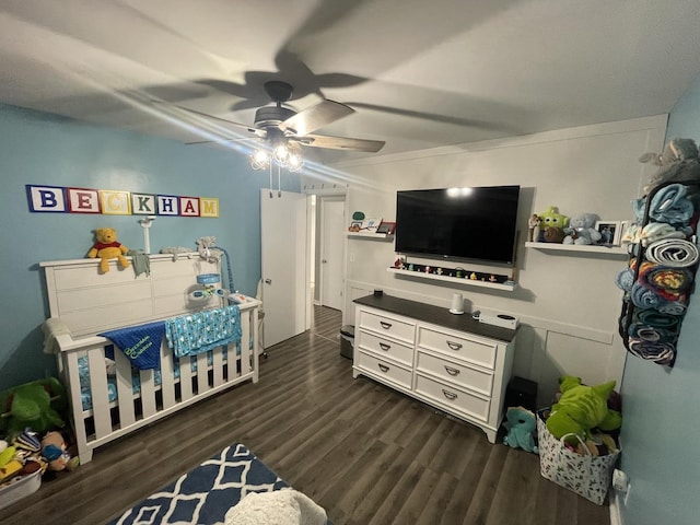 bedroom featuring dark wood finished floors and a ceiling fan