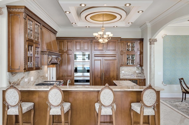 kitchen with stainless steel appliances, custom range hood, glass insert cabinets, ornamental molding, and a peninsula