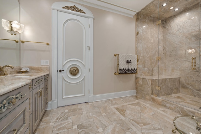 bathroom featuring a shower stall, baseboards, crown molding, and vanity