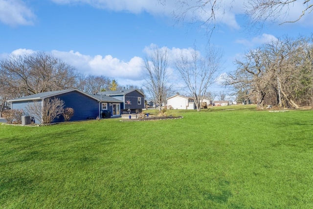 view of yard featuring central AC