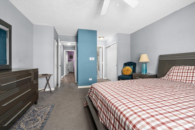 bedroom with a textured ceiling, dark carpet, a ceiling fan, and baseboards