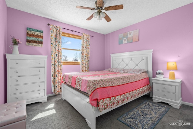 bedroom featuring baseboards, ceiling fan, dark carpet, and a textured ceiling