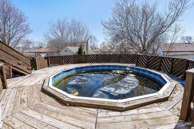 view of swimming pool featuring a jacuzzi