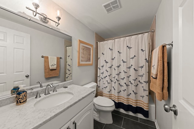 full bathroom featuring toilet, vanity, visible vents, and tile patterned floors