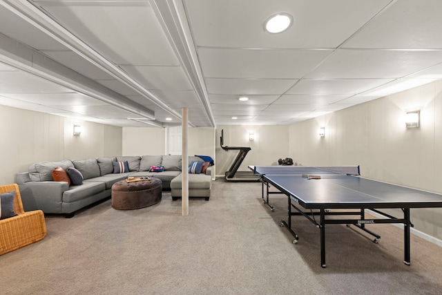 playroom featuring carpet floors and a paneled ceiling