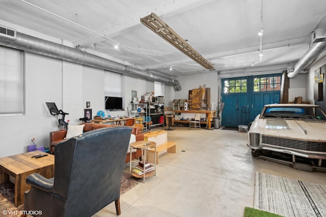 garage with visible vents and a workshop area