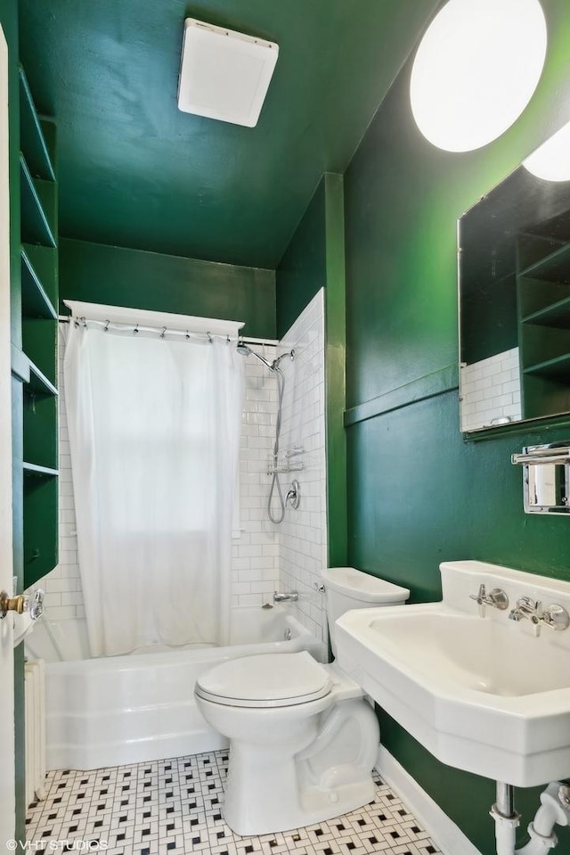 bathroom featuring toilet, radiator, and shower / bath combo with shower curtain