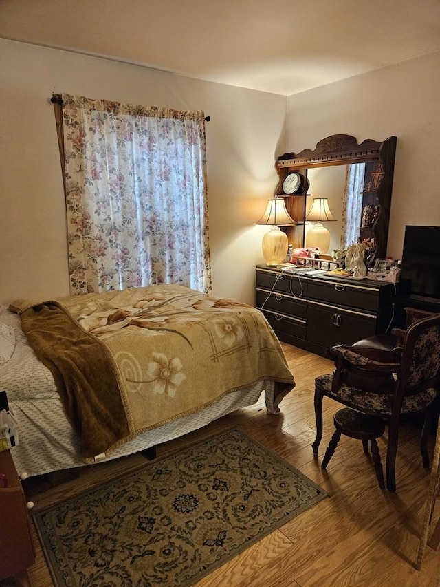 bedroom featuring light wood-style flooring