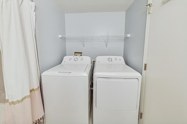 laundry area with laundry area and washer and dryer