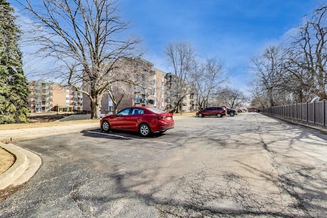 uncovered parking lot with fence