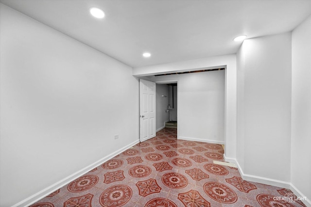 basement with recessed lighting and baseboards