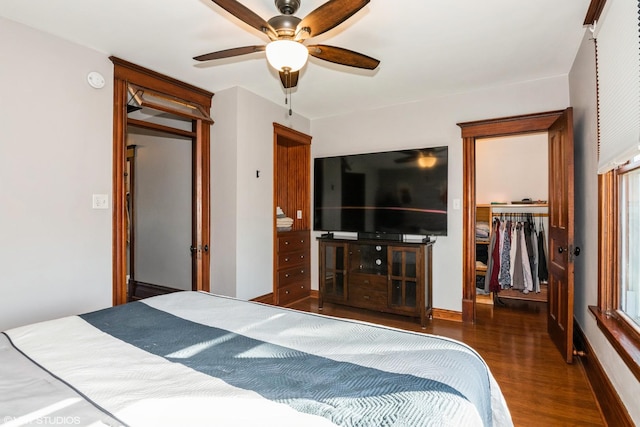 bedroom with a closet, wood finished floors, and a ceiling fan