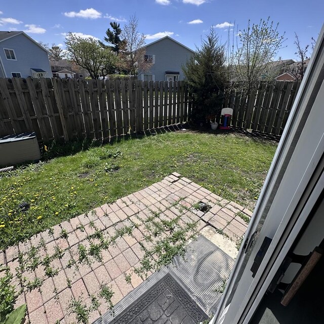 view of yard with a patio and a fenced backyard