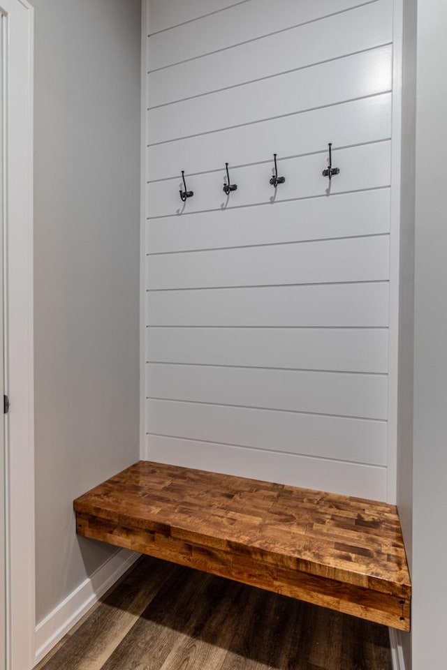 mudroom with baseboards and wood finished floors