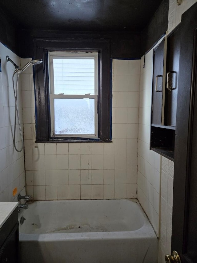 bathroom featuring tub / shower combination and vanity