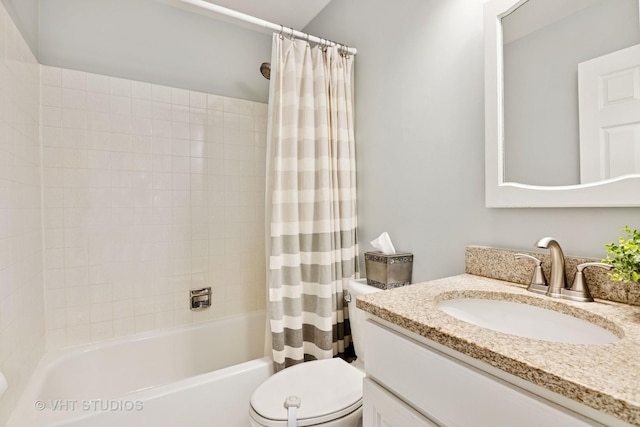 full bath with shower / tub combo, vanity, and toilet