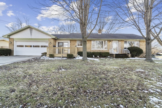 ranch-style home with driveway, brick siding, a chimney, and an attached garage