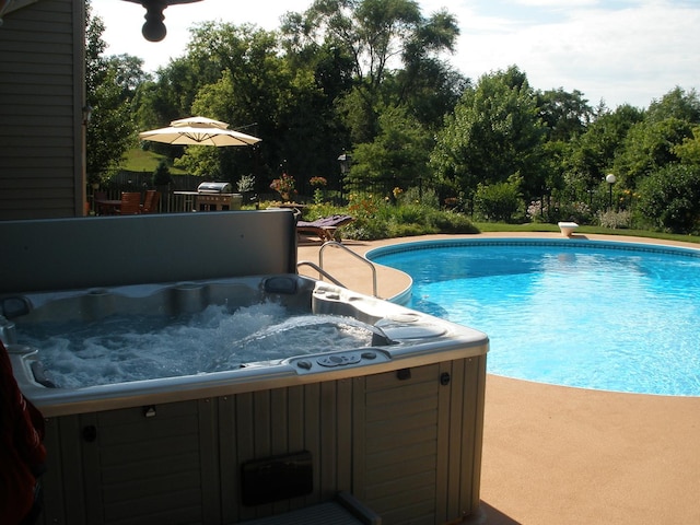 pool featuring a hot tub