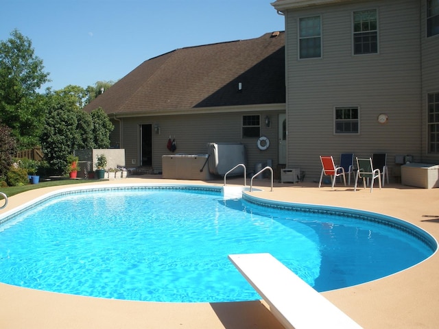 view of swimming pool with a patio, fence, and a fenced in pool