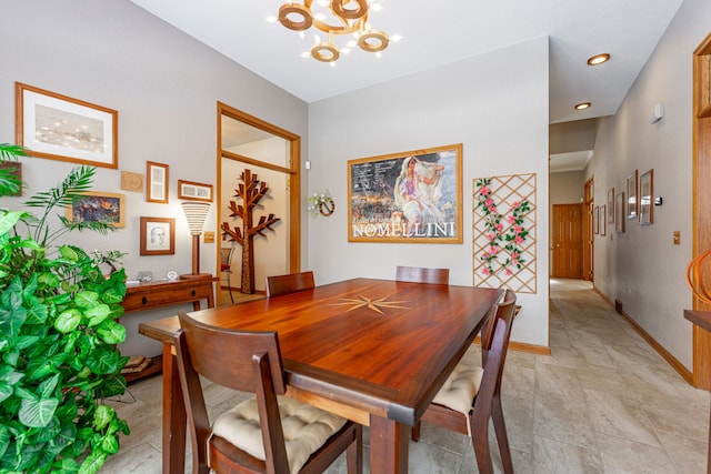 dining space with a chandelier, recessed lighting, and baseboards