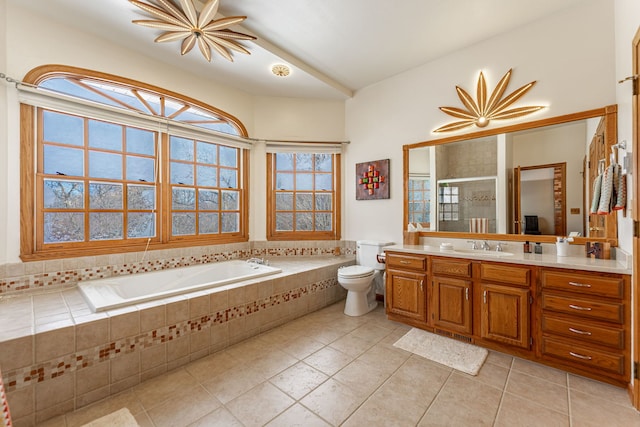 full bathroom featuring a stall shower, toilet, tile patterned flooring, vanity, and a bath