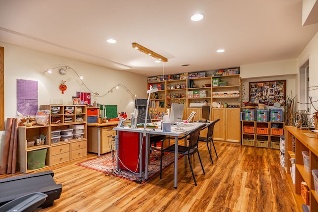 home office featuring light wood-style flooring and recessed lighting