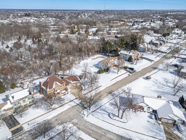 snowy aerial view featuring a residential view