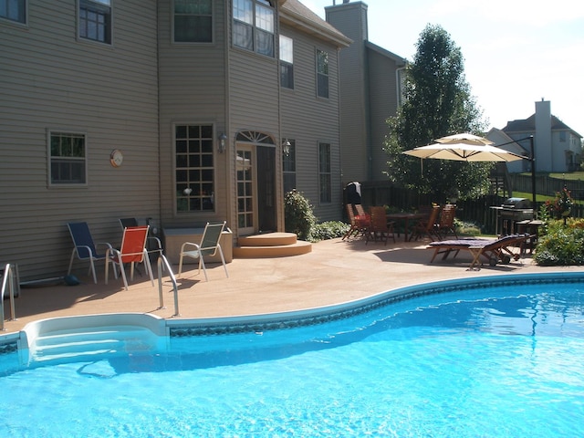 view of pool with a patio area and a fenced in pool